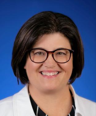 Dr. Piatt headshot with blue background