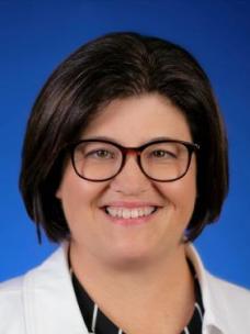 Dr. Piatt headshot with blue background